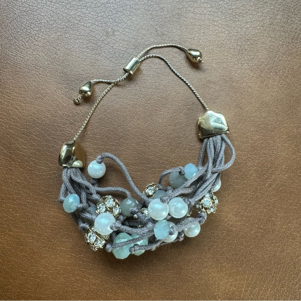 Adjustable multi-strand bracelet